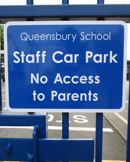 school signage on railings at Queensbury School